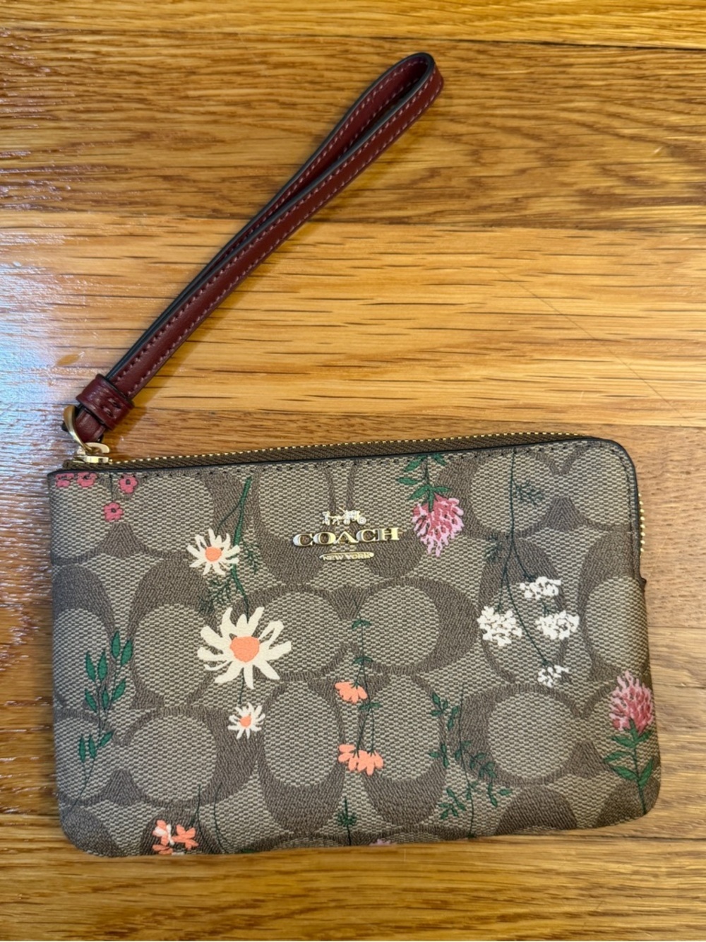 Coach Corner Zip Wristlet In Signature Canvas With Wildflower Print